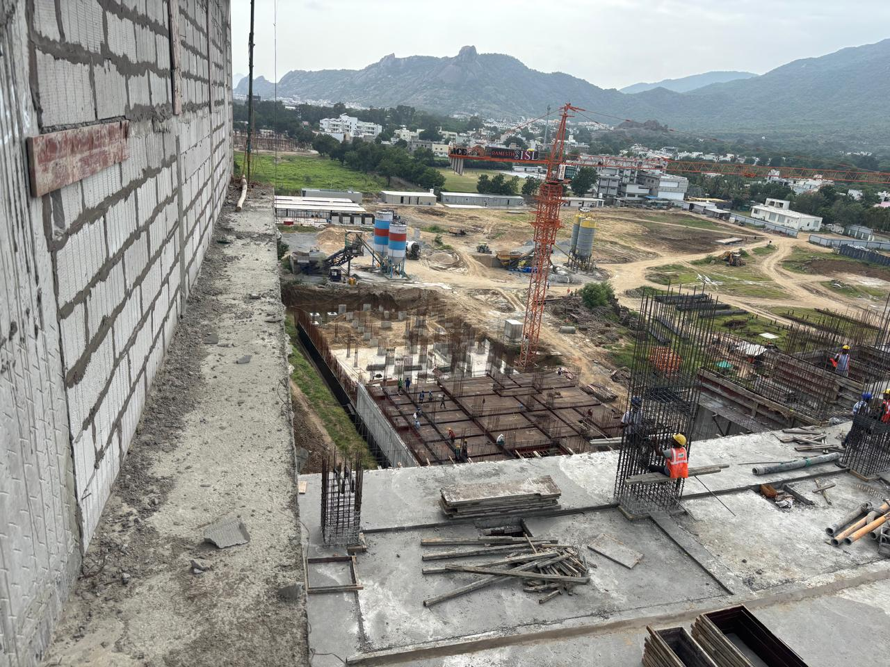 Construction site overlooking the green hills of Mount Abu