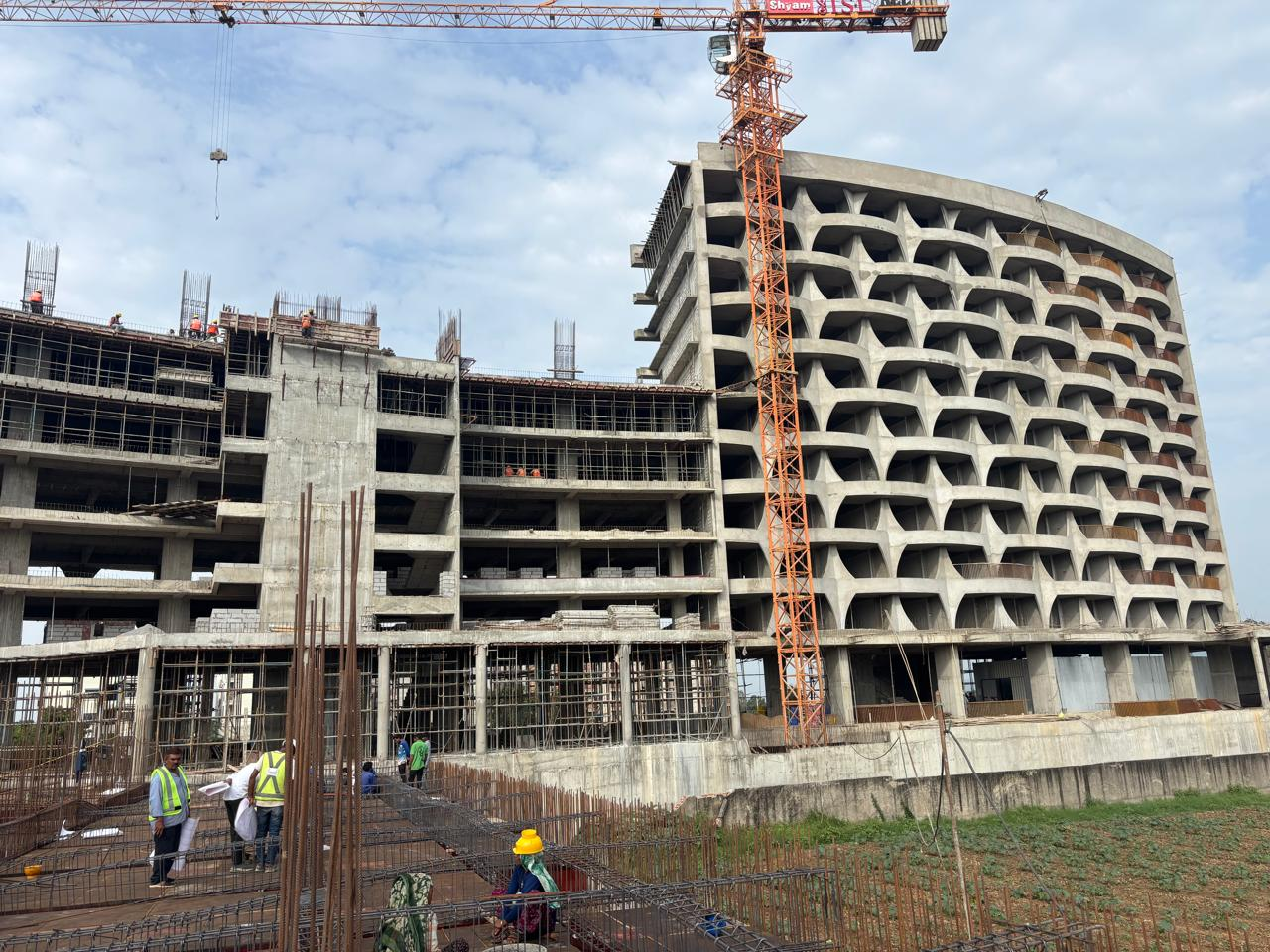Curved façade taking shape at Infinite Spiritual Lifestyle