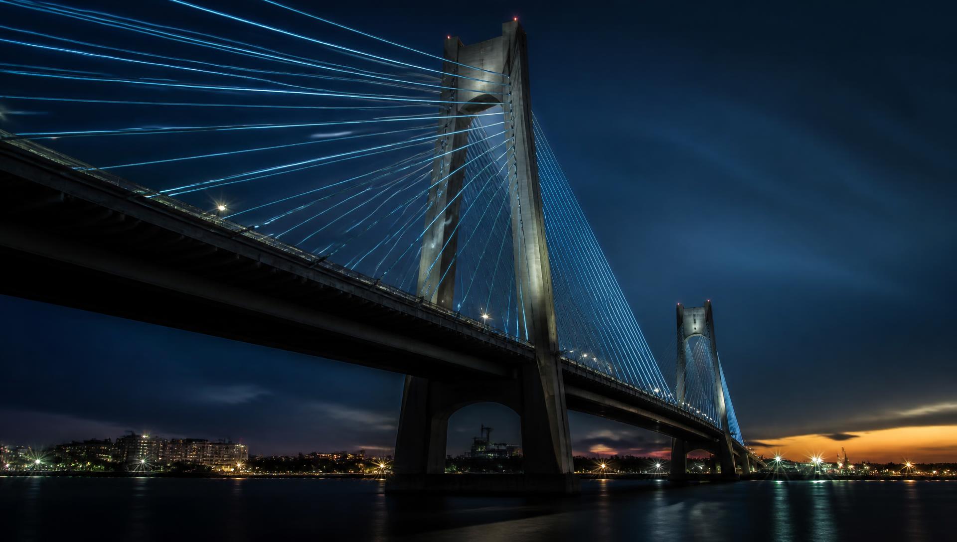 Cable-stayed mega bridge lit at dusk